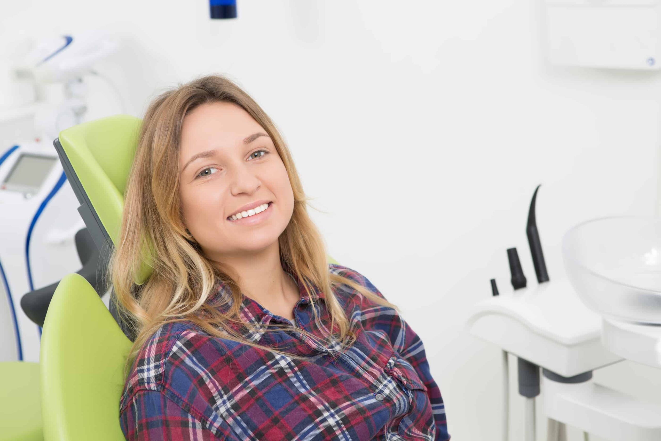 bigstock Young lady at dentist s office 116945459 scaled