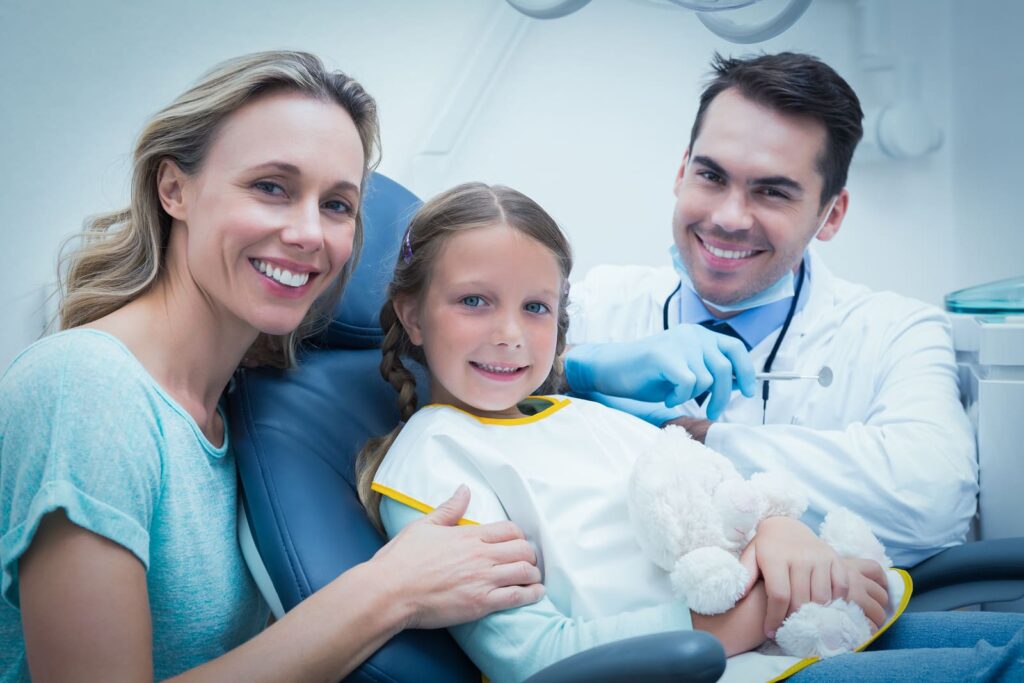 bigstock Dentist examining girls teeth 80308934