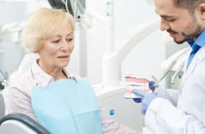 dentist speaking to elder patient