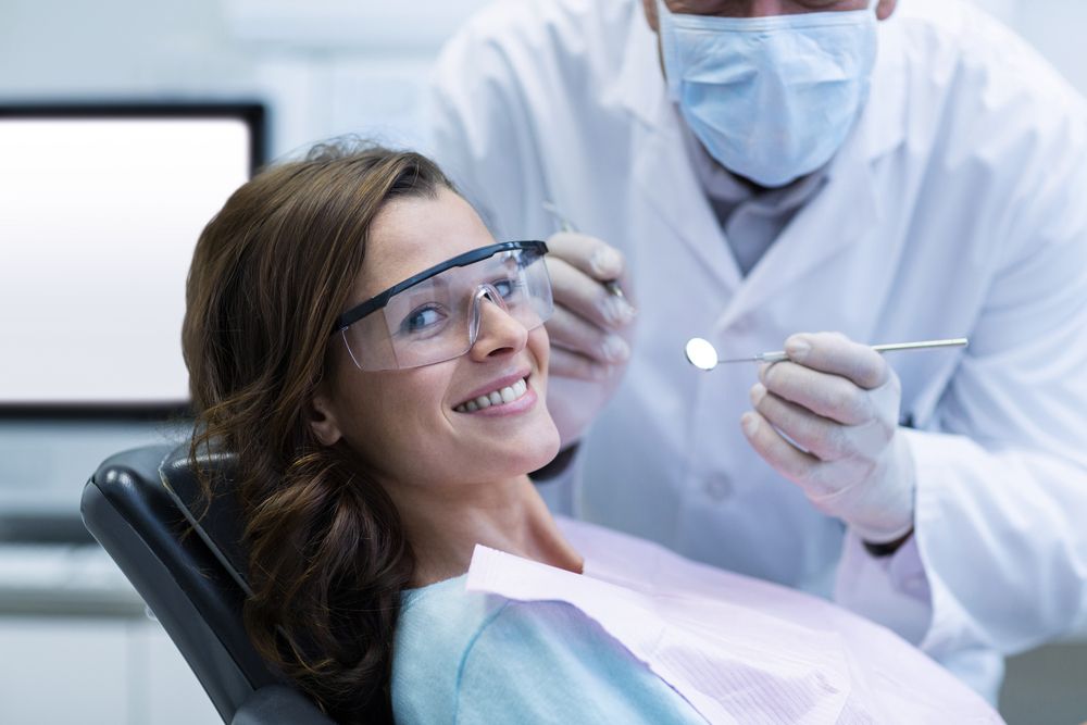 Dentist Examining Woman Teeth — Albany Dental in Gosford, NSW