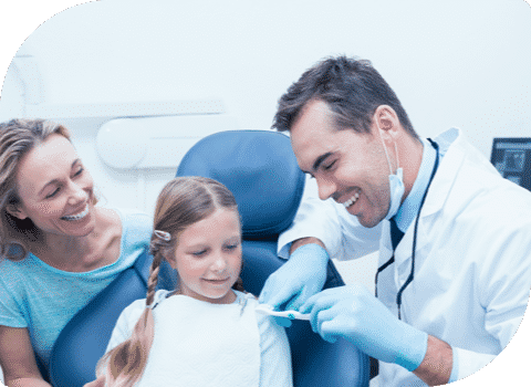 Dentist Showing How To Take Care Of Teeth — Dentist In Gosford, NSW