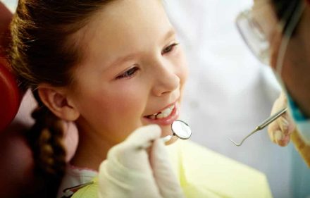 A Little Smiling Girl At Dentist