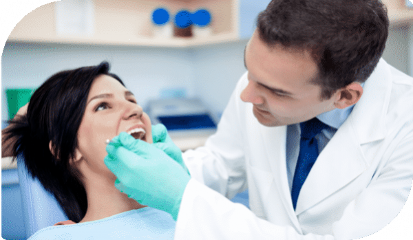 Dentist Checking Up Woman's Teeth — Dentist In Gosford, NSW