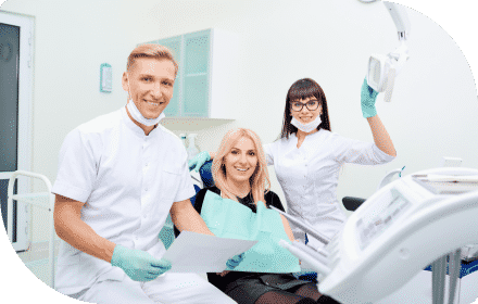 Woman With Dentist and Assistant — Dentist In Gosford, NSW