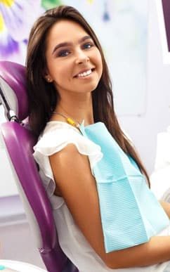 young patient sitting in dentist chair