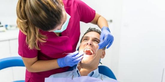 Man In Dental Chair — Dentist In Gosford, NSW