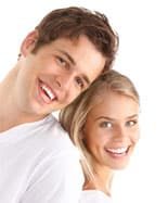 Couple In White Smile — Dentist In Gosford, NSW