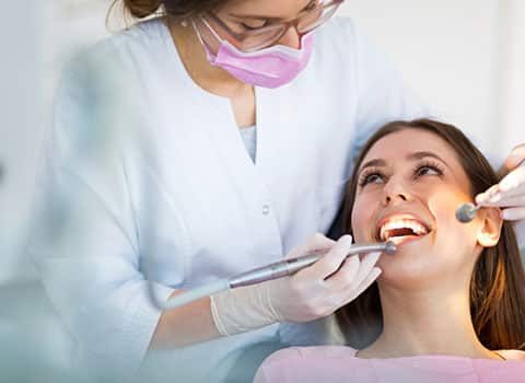 dentist performing emergency dental treatment