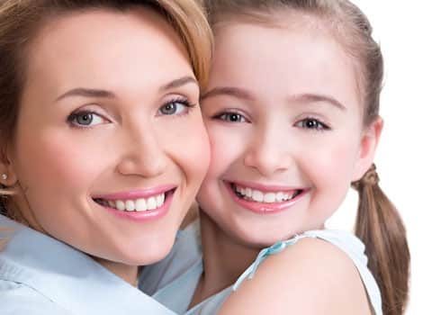 woman smiling with her daughter