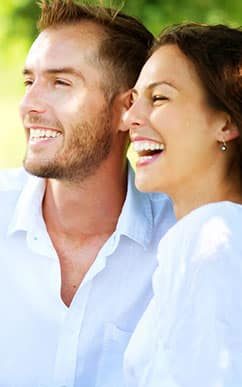 woman and man smiling and laughing